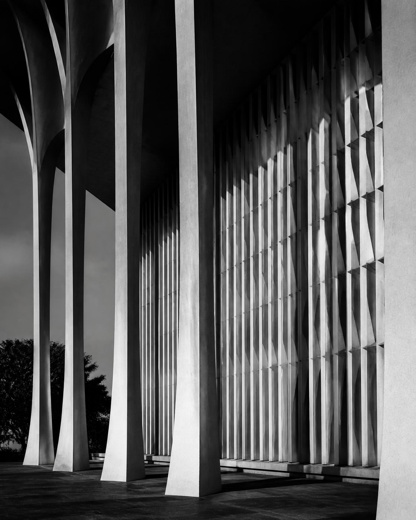 Monochrome architectural detail of a colonnade on a modern Nigerian government building